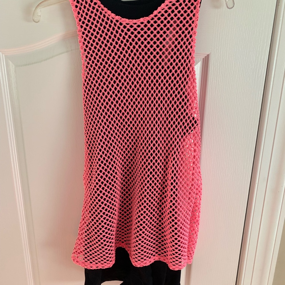 Black romper with pink mesh overlay .